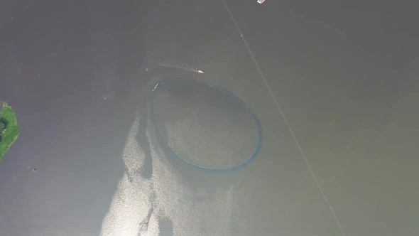 Aerial view of people working with fishing nets, Rajshahi, Bangladesh.