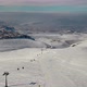 Aerial View Snow Mountain Peak Clouds in Background  Winter Drone Footage Ski Resort - VideoHive Item for Sale