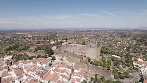 Castelo de Vide perched castle and surrounding landscape, Portugal. Aerial orbiting
