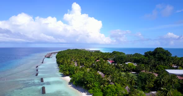 Luxury overhead tourism shot of a summer white paradise sand beach and turquoise sea background in h