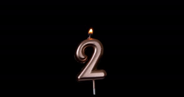 Realistic full-sized single birthday candlelight 2 two number isolated on black background