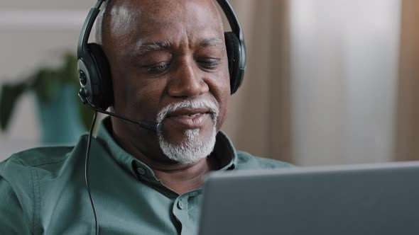 Portrait Old Bald African Businessman with Gray Beard Aged Male in Headset Teacher in Headphones