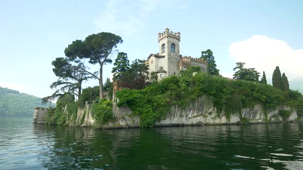 An island with a castle in an Italian lake