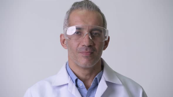 Happy Persian Man Doctor Wearing Protective Glasses