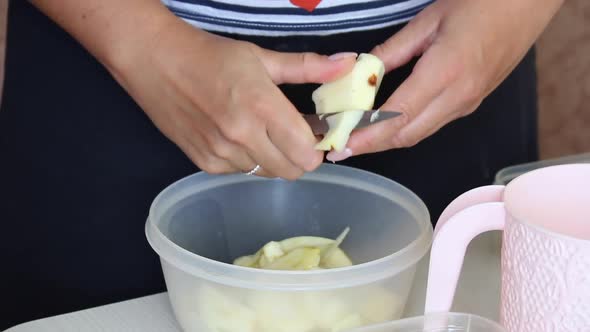 A Woman Cuts Apples. Ingredients For Making Apple Pie. Cooking Charlotte At Home.