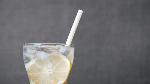 Freshness drink with lemon with straw.