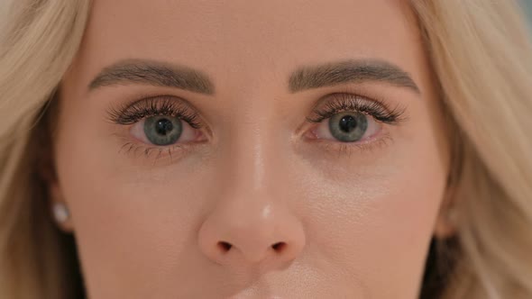 Close Up of Blinking Eyes of Young Woman
