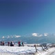 Snowy Landscape of Mountains Range with People on Slope in Sunshine Under Clear Blue Sky - VideoHive Item for Sale