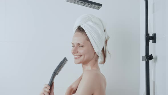 Smiling Female Takes a Shower