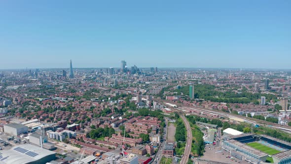 Pan drone shot across London skyline sunny day