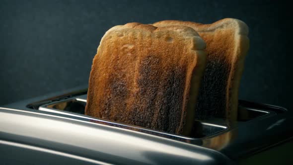 Well Done Toast Is Taken From Toaster