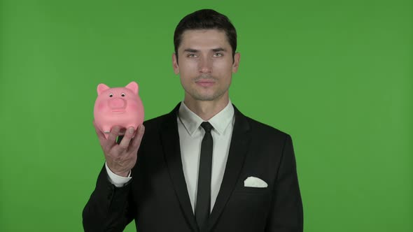 Cheerful Young Businessman Holding Piggy Bank, Chroma Key