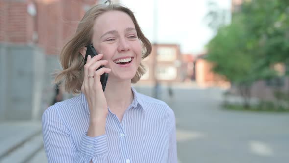 Portrait of Woman Talking on Phone Outdoor