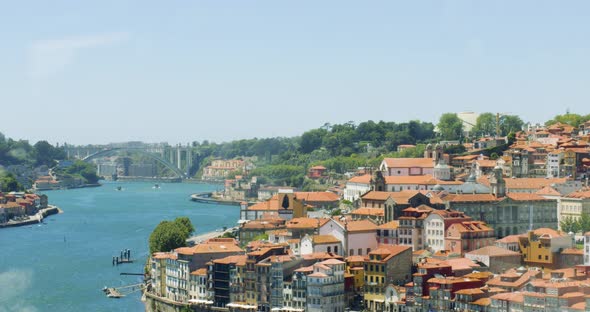 Oldtown next to Douro River in Central Porto, Portugal 4K SLOWMO CINEMATIC AERIAL SUMMER MEDITERRANE