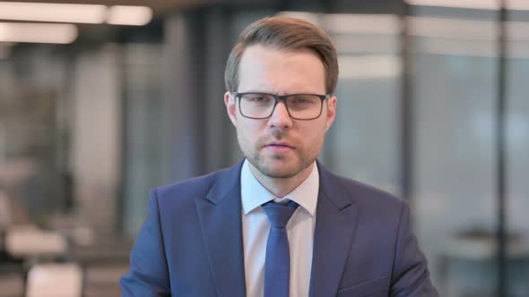 Portrait of Businessman Looking Around, Searching