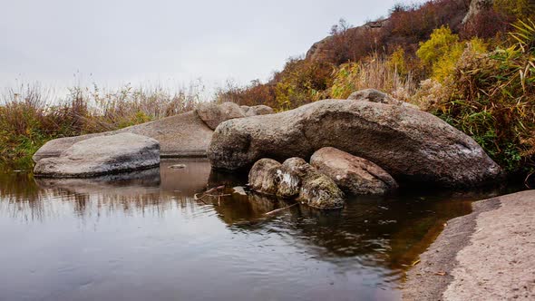 Autumn Trees and Large Stone Boulders Around