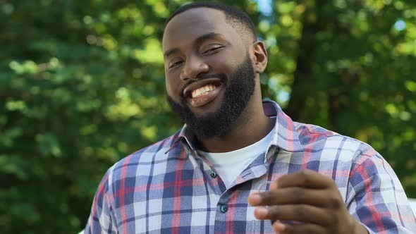 Emotional Afro-American Guy Demonstrating Auto Keys to Camera, Getting Loan