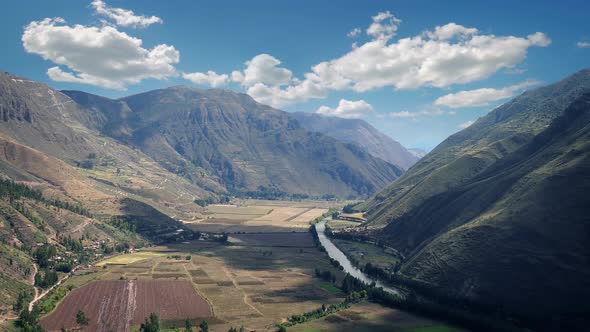 Clouds Casting Shadows Over Sunny Valley