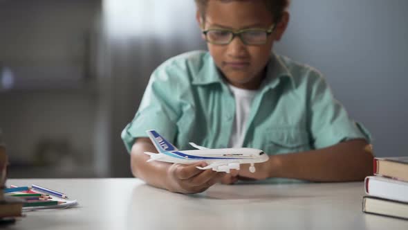 Boy Dreaming of Becoming Pilot of Modern Airline and Flying to Faraway Countries