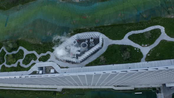 Aerial Shot of Rooftop of Amager Slope with Steam Coming Out of the Chimney