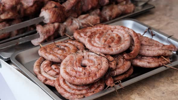 ReadytoEat Sausages and Various Baked Food on BBQ in Showcase at Food Court