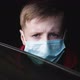 Kid in a Medical Mask Waving Goodbye and Looks Through the Car Window. - VideoHive Item for Sale