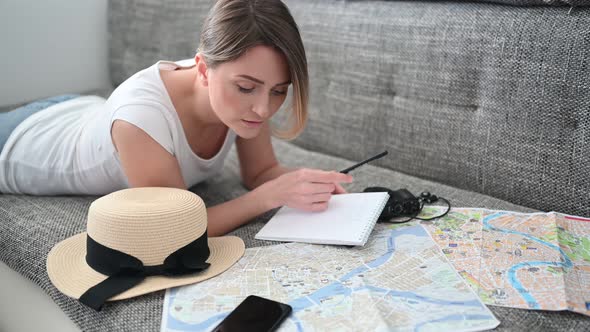 Happy Woman Planning Vacation Travel Trip at Home After End of Pandemic and Quarantine. Girl Looking