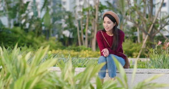 Woman enjoy and look at the plant and flower