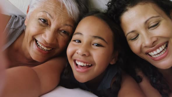 Happy family lying on bed in bed room 4k