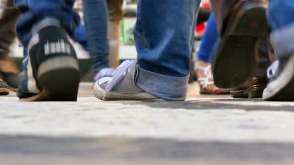 Variety of People Feet Walking on the Street