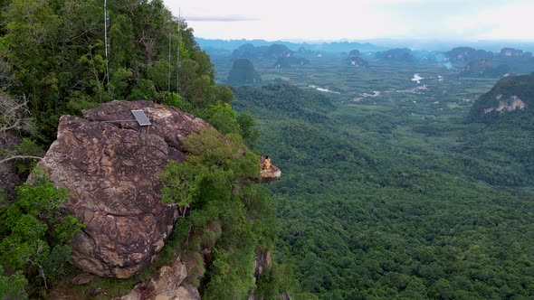 Dragon Crest Rock in the Jungle of Krabi Thailand Couple Men and Woman Looking Out Over Jungle