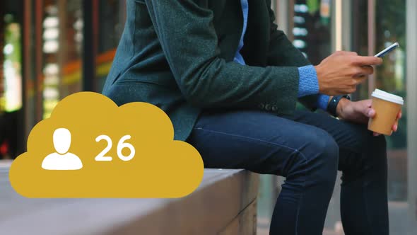 Man sitting on a brick platform checking his phone 4k