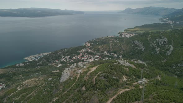 A Drone View of a Mountain Road and a Small Coastal Town in the Makarska Riviera Region of Croatia