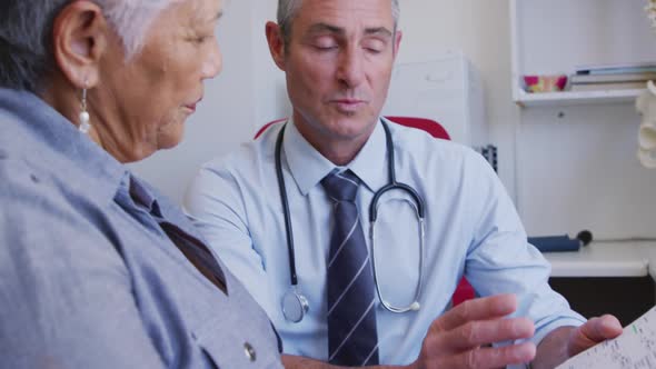 Doctor examining a senior woman in a retirement home