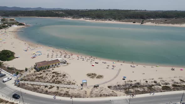 Idyllic Praia da Franquia on bank of Mira River estuary, Portugal; drone