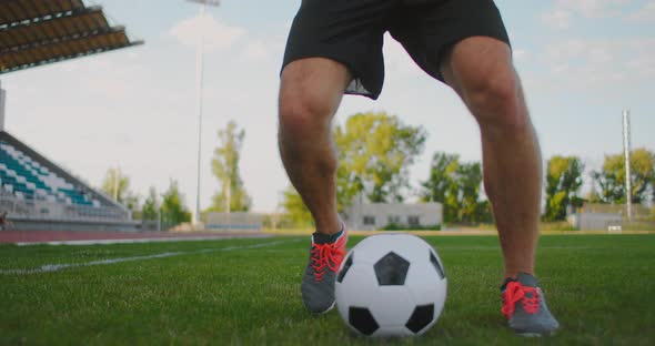 Skill Professional Soccer Player a Man Runs in with a Soccer Ball on a Soccer Field in a Stadium