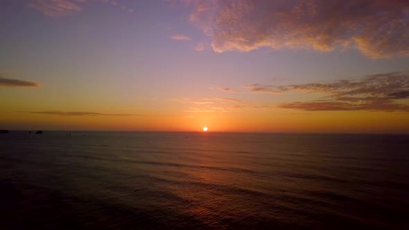 Sunset above water aerial