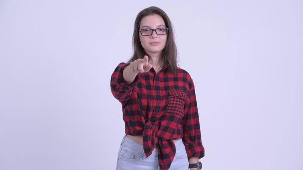 Happy Young Beautiful Hipster Woman Pointing at Camera