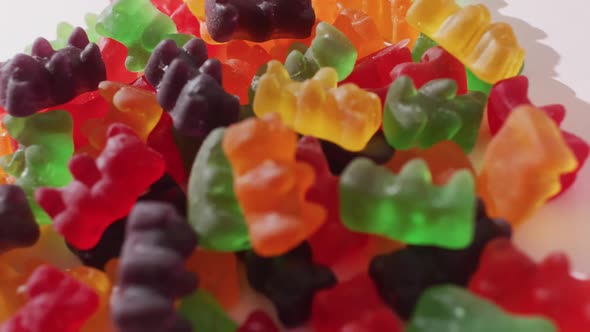 Video of colourful jelly candy on white background