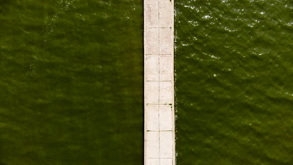 Flying Over Stone Pier Built on the Shore of Baltic Sea