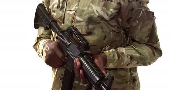 Portrait of military soldier holding machine gun