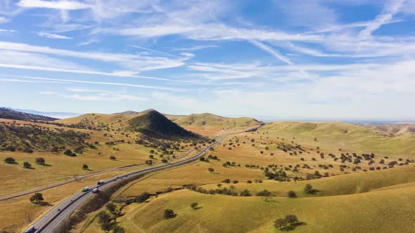 Highway and Hilly Farmland. Kern County. California, USA. Aerial View