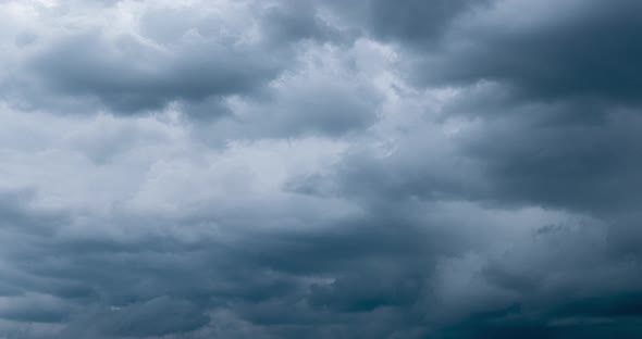 Cloudscape with Grey Cumulus Clouds Floating Along Sky