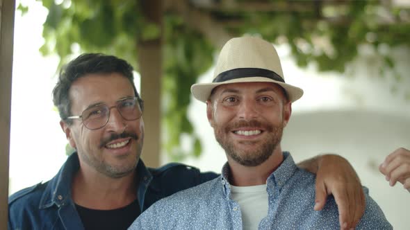 Slow Motion of Happy Guy Couple Looking at Camera