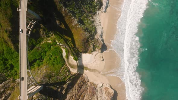 Teal Blue Ocean Waves Beautiful Shore Aerial Top Down  Vertical Mobile Shot