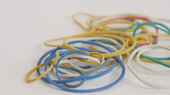 Colorful rubber bands  close-up 4K slow tilt video