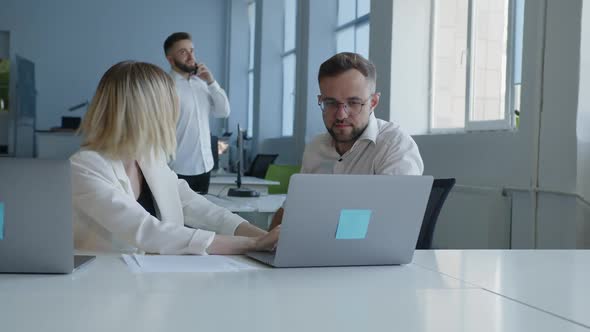 Work Together of Man and Woman in an Office