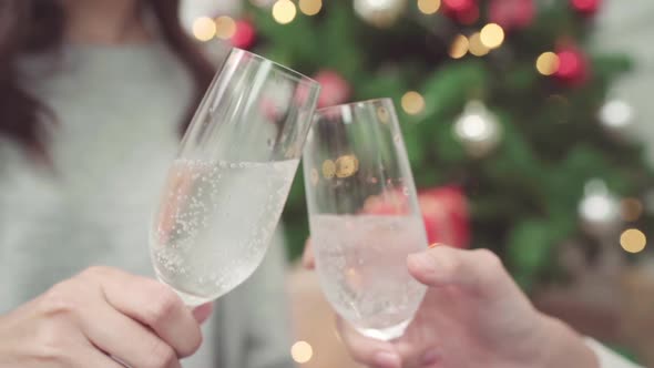 Group young Asian woman holding and drinking champagne in christmas party.