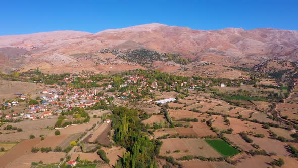 Scenic Aerial View of Mountain Valley with Agricultural Fields