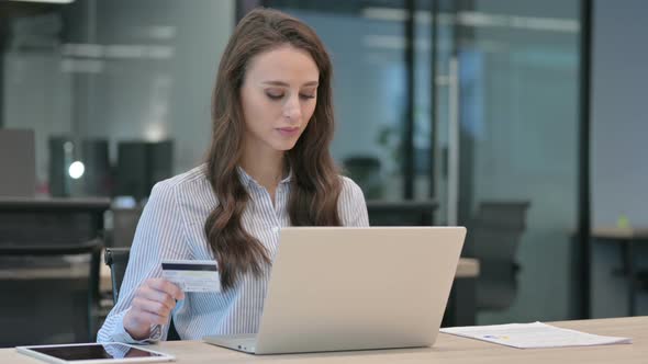 Online Shopping Payment Failure on Laptop by Young Businesswoman